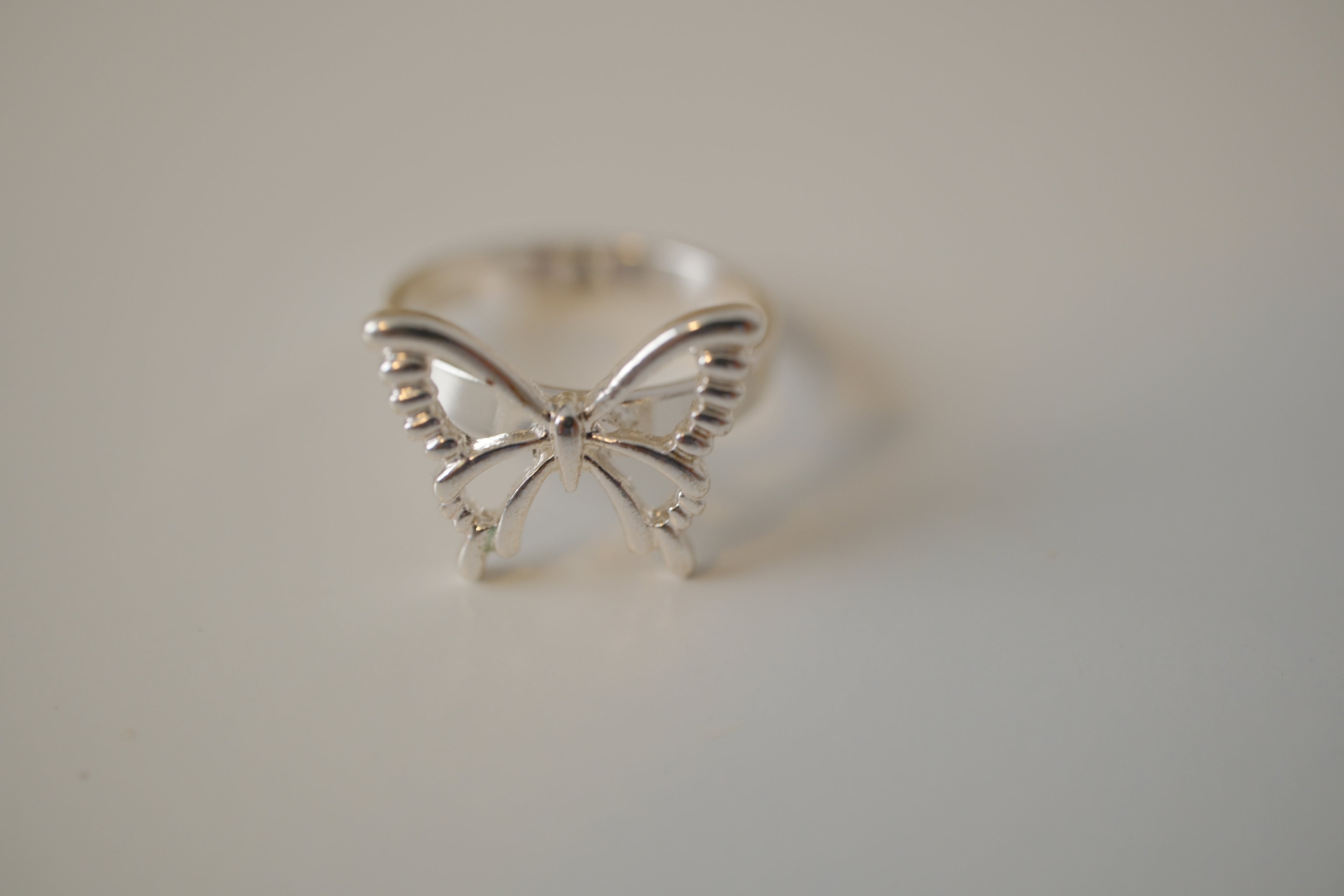 Silver tone delicate butterfly ring