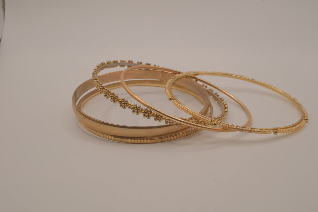 Set of 6 textured and floral gold-tone bangles
