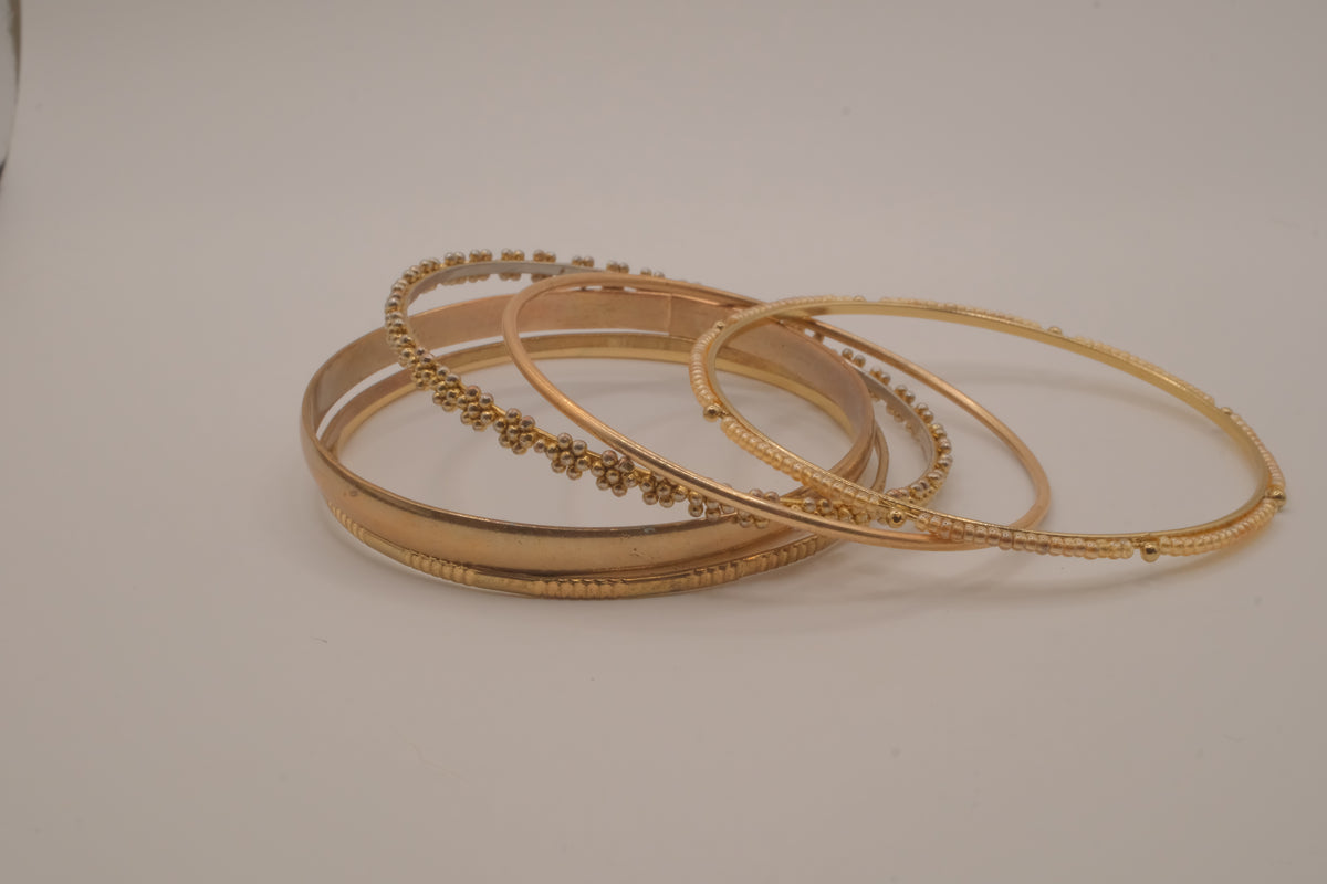 Set of 6 textured and floral gold-tone bangles