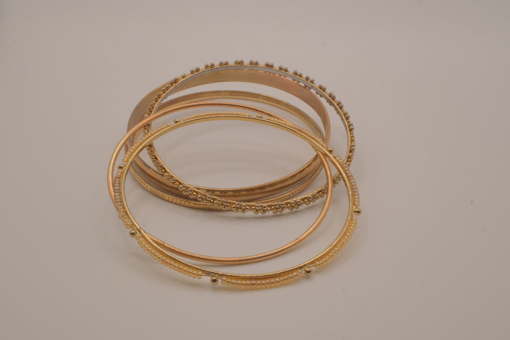 Set of 6 textured and floral gold-tone bangles