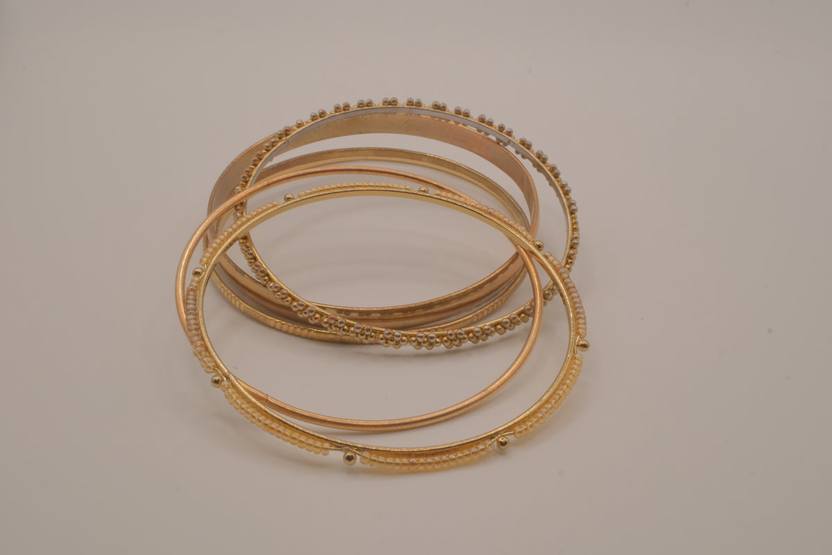 Set of 6 textured and floral gold-tone bangles