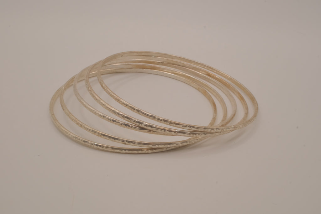 Set of 5 thin, textured silver tone bangle bracelets