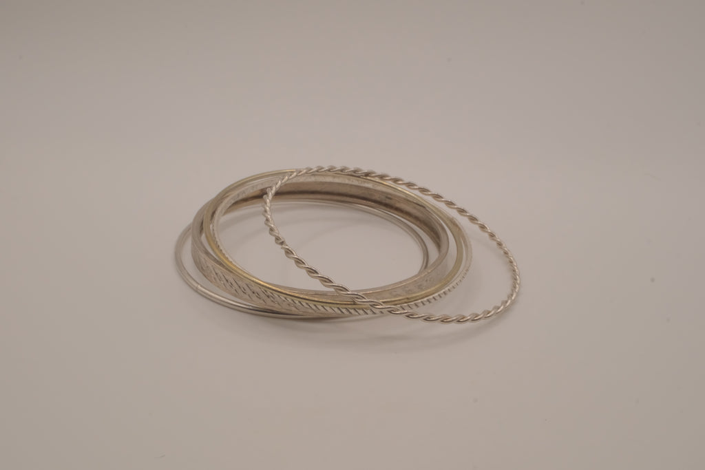 Set of 5 stacked mixed-textures silver &nbsp;tone bangle bracelets