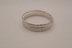 Vintage-style stack of 5 silver tone bangles