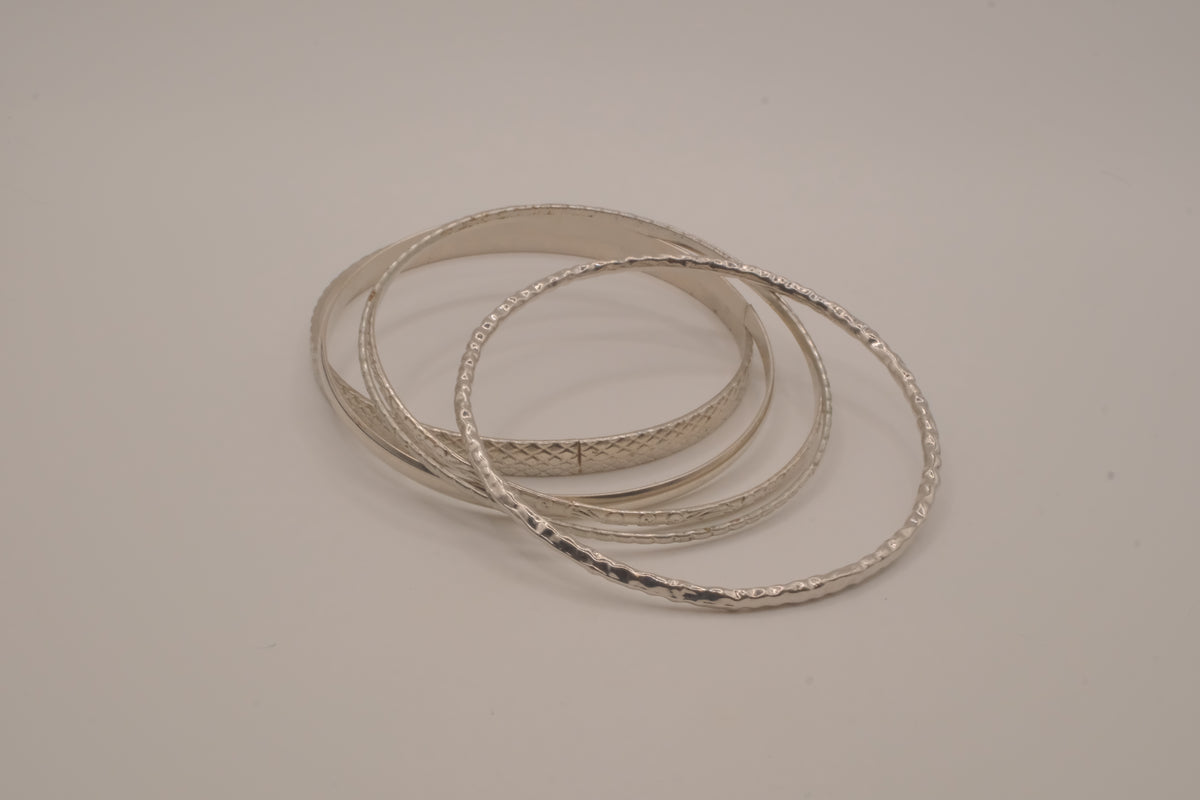 Vintage-style stack of 5 silver tone bangles