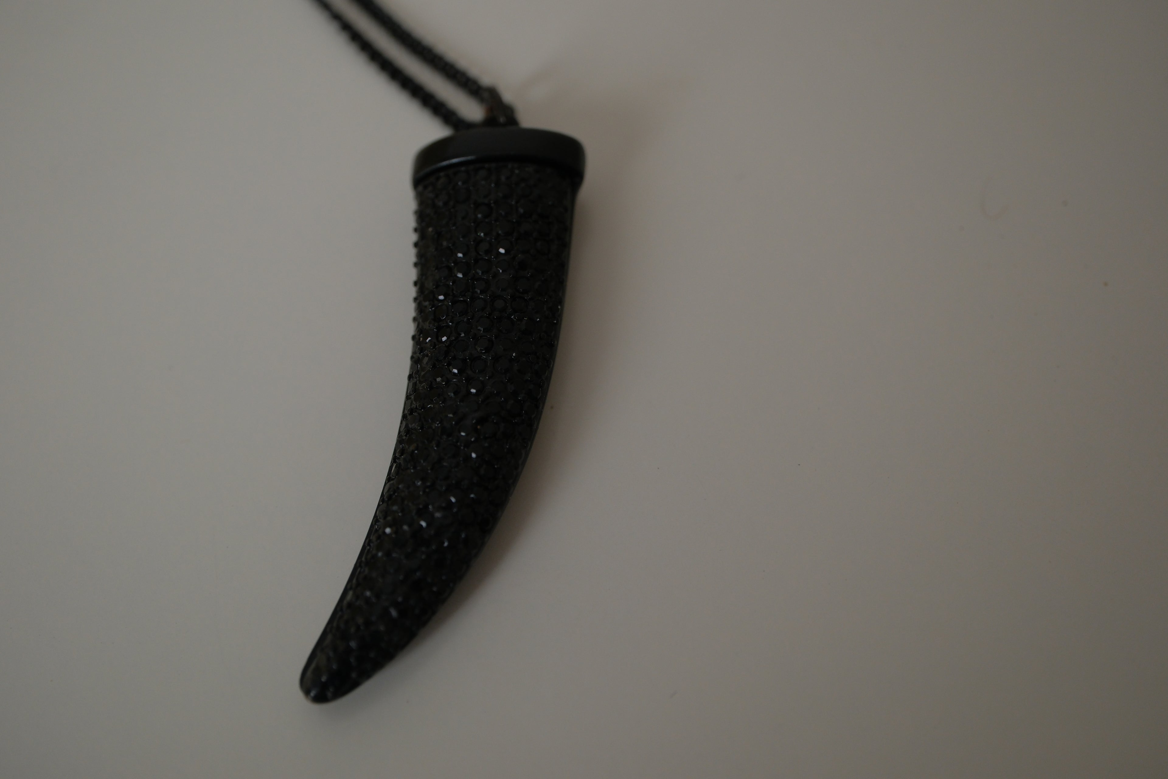 Black pave-encrusted horn/tooth pendant necklace
