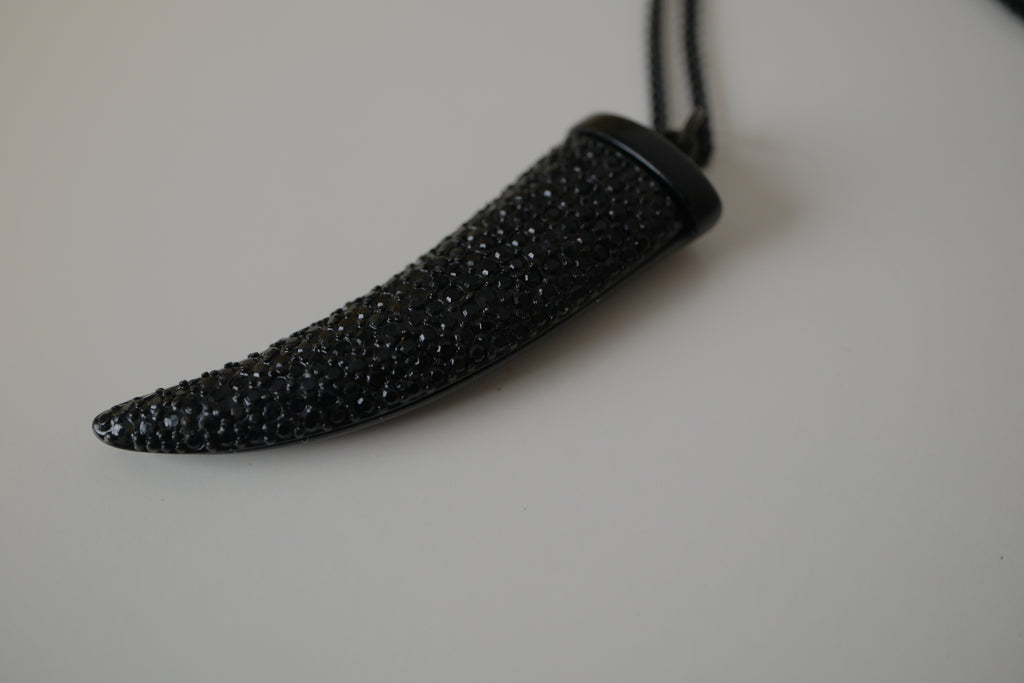 Black pave-encrusted horn/tooth pendant necklace