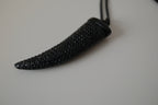Black pave-encrusted horn/tooth pendant necklace