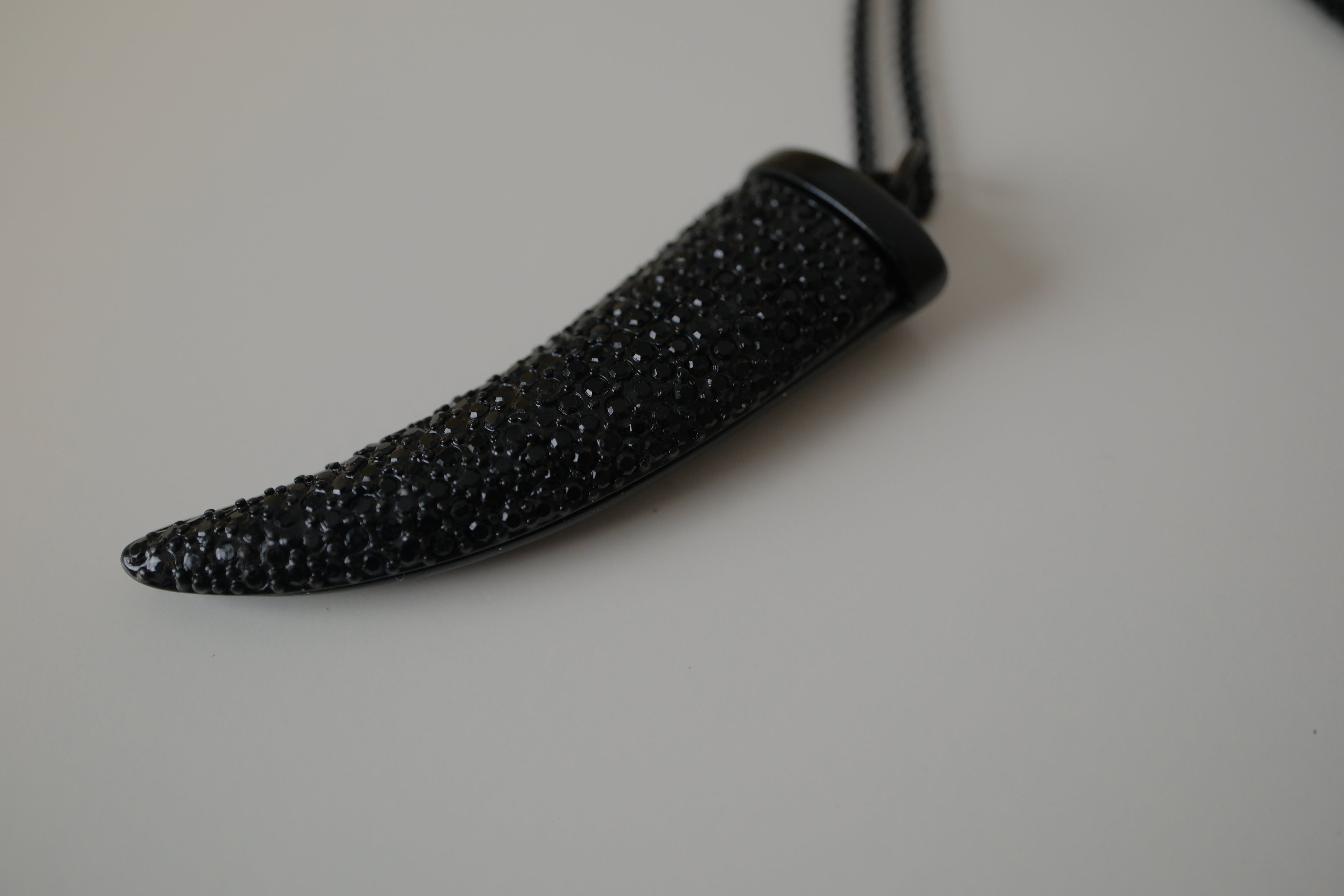 Black pave-encrusted horn/tooth pendant necklace