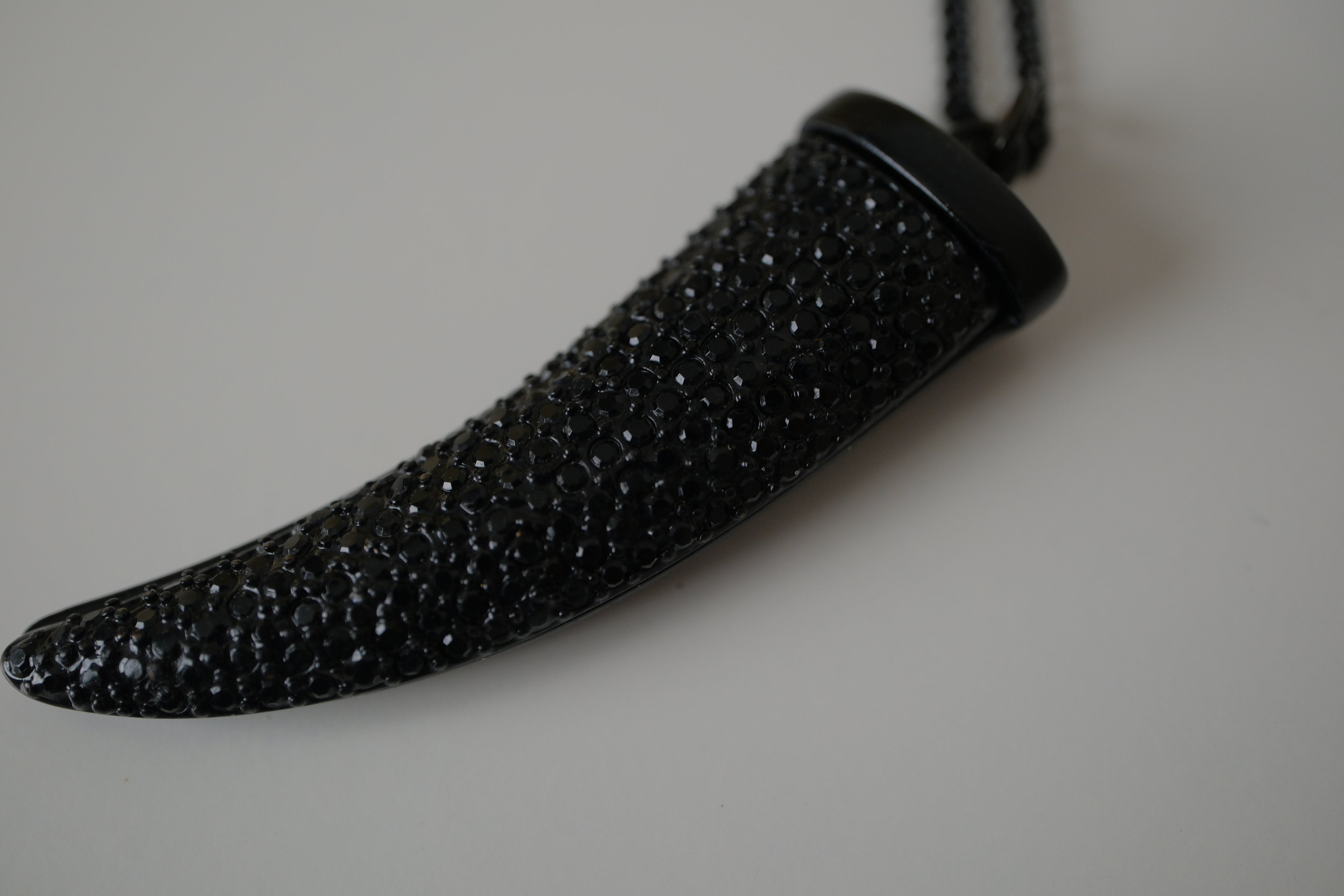 Black pave-encrusted horn/tooth pendant necklace