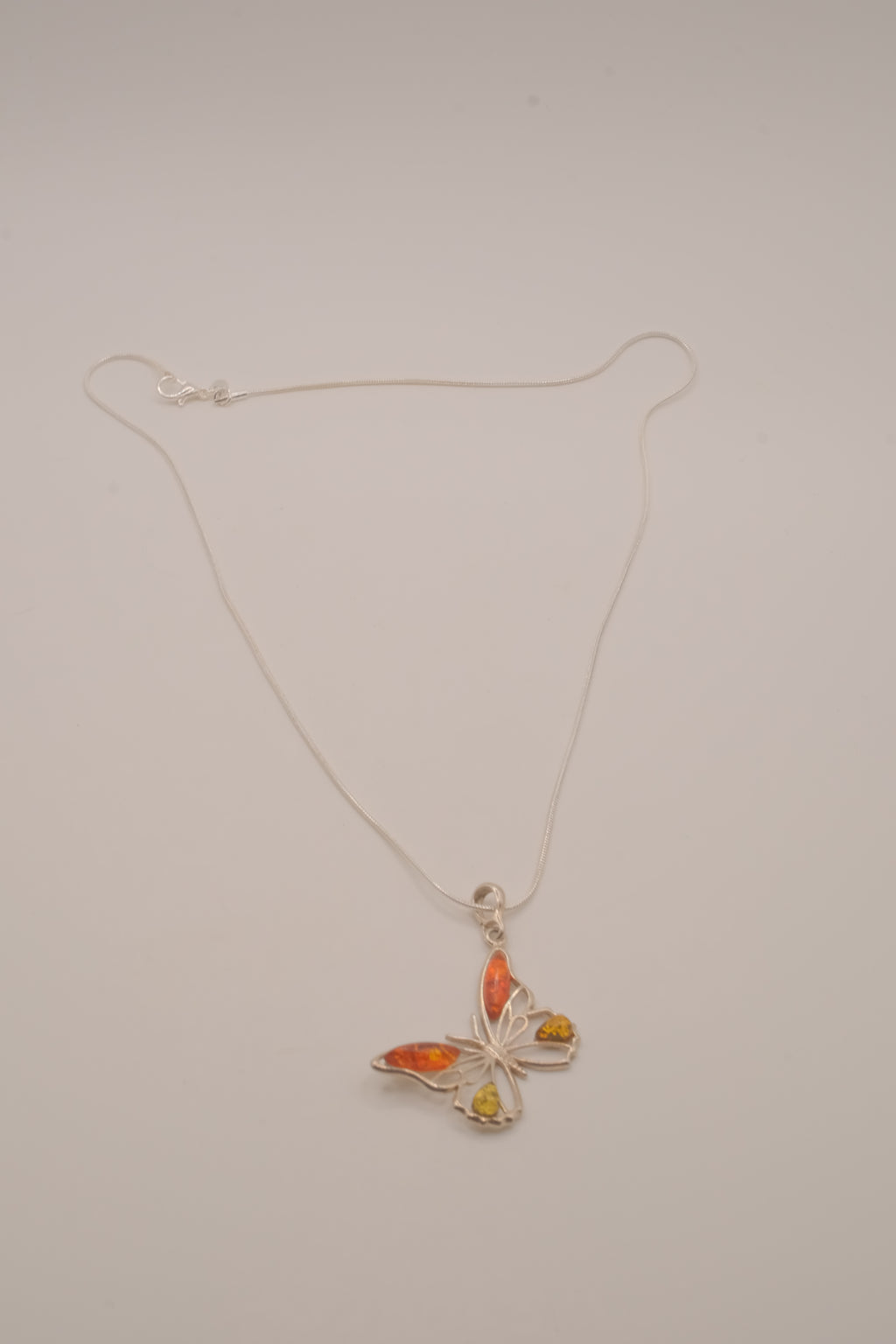 Sterling silver Baltic amber butterfly pendant necklace
