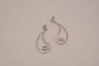 Silver tone teardrop open-frame dangle earrings