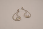 Silver tone teardrop open-frame dangle earrings