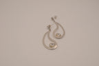 Silver tone teardrop open-frame dangle earrings