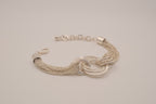 Silver tone multi-strand bracelet