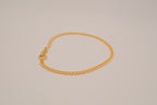 Gold tone herringbone chain bracelet