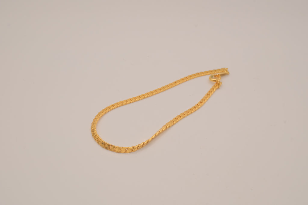 Gold tone herringbone chain bracelet
