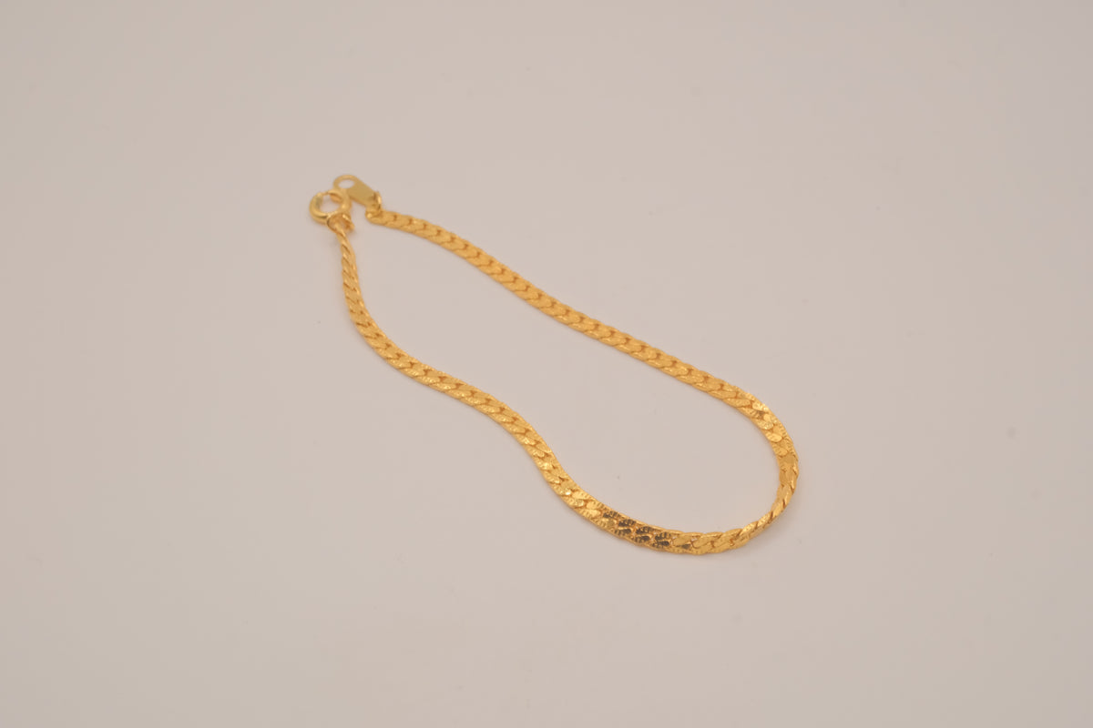 Gold tone herringbone chain bracelet