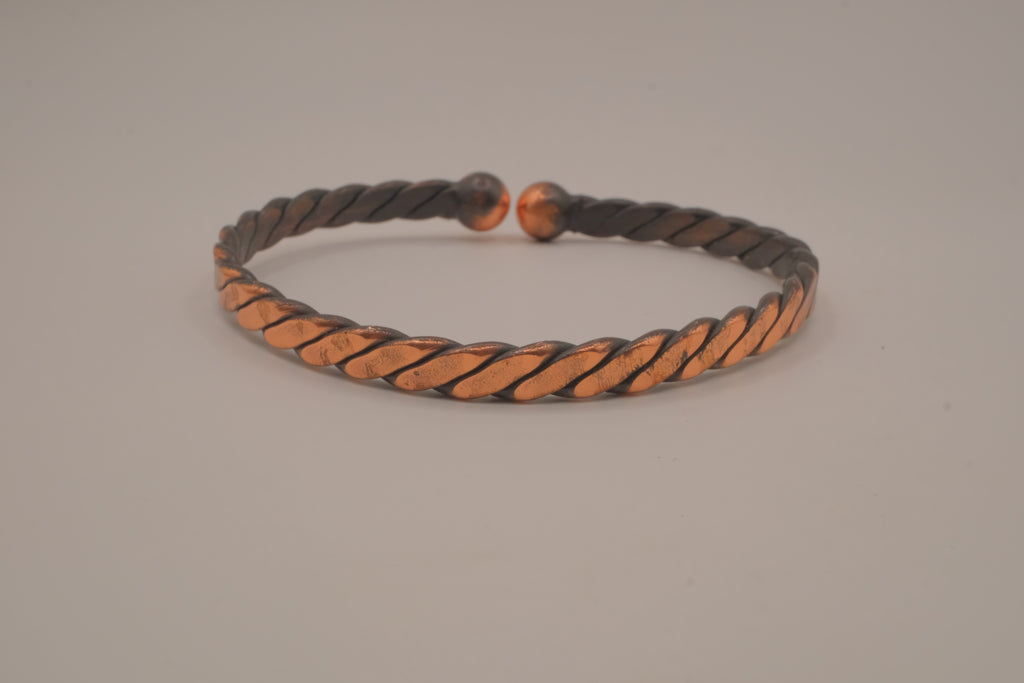 Handcrafted twisted copper arm cuff