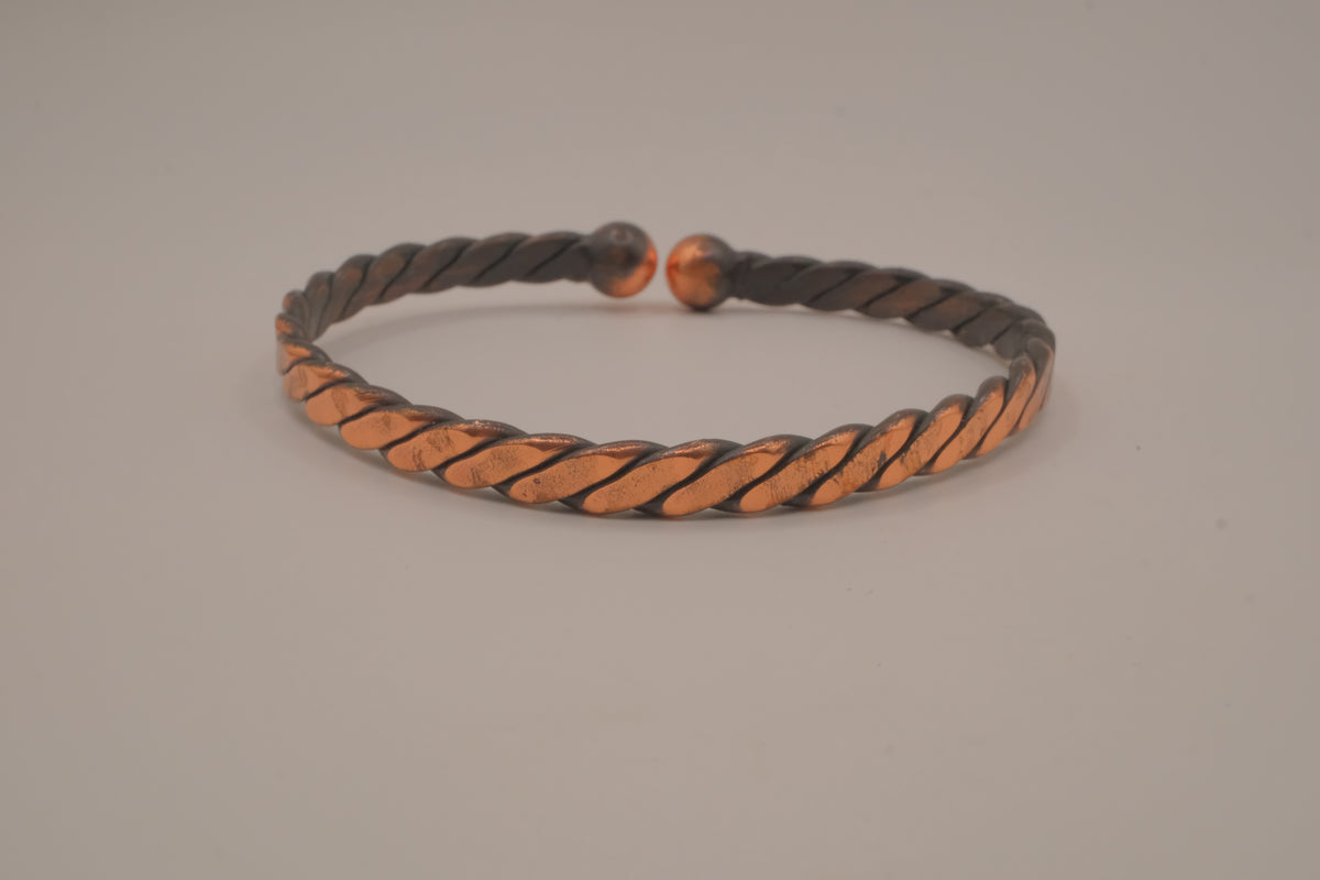 Handcrafted twisted copper arm cuff