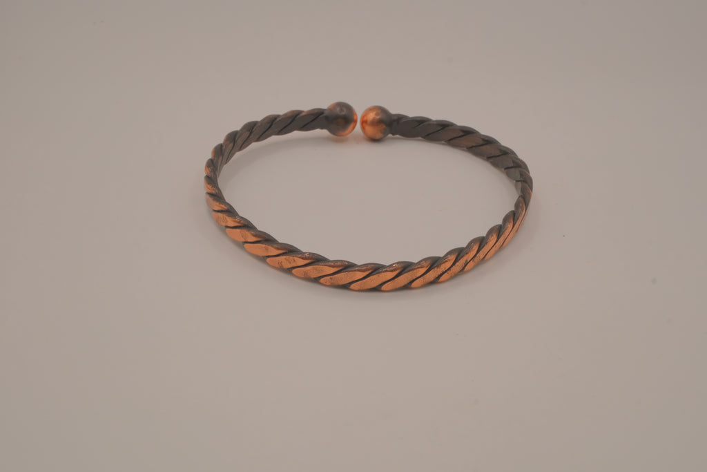 Handcrafted twisted copper arm cuff