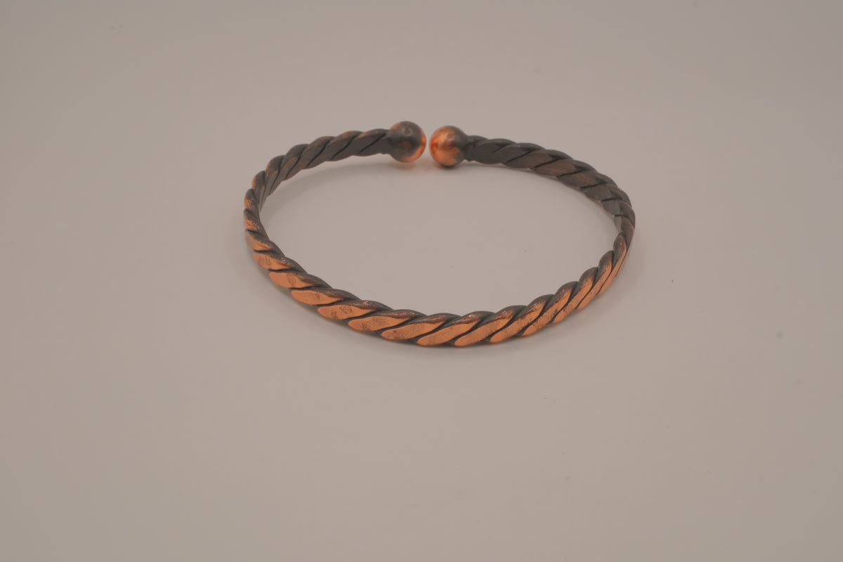 Handcrafted twisted copper arm cuff