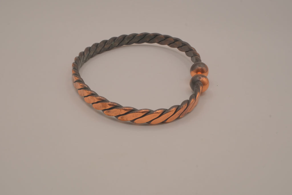 Handcrafted twisted copper arm cuff