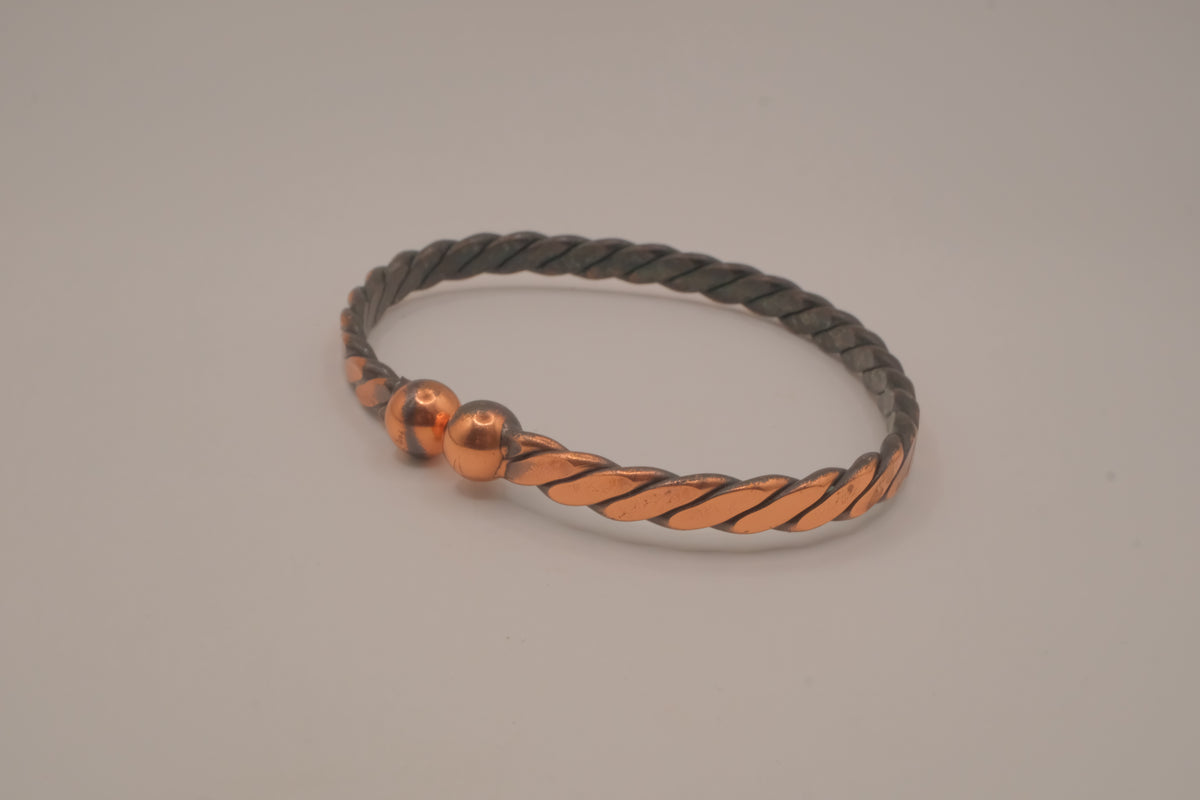 Handcrafted twisted copper arm cuff