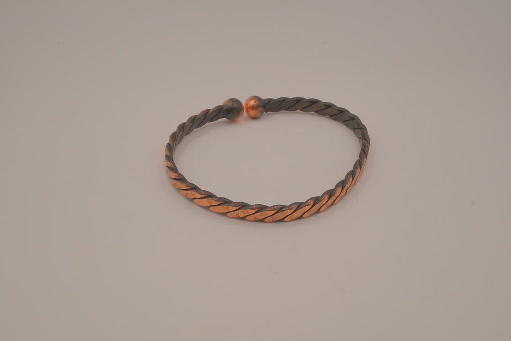 Handcrafted twisted copper arm cuff