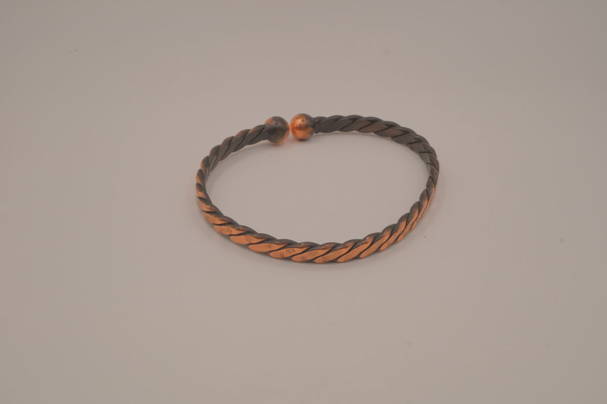 Handcrafted twisted copper arm cuff