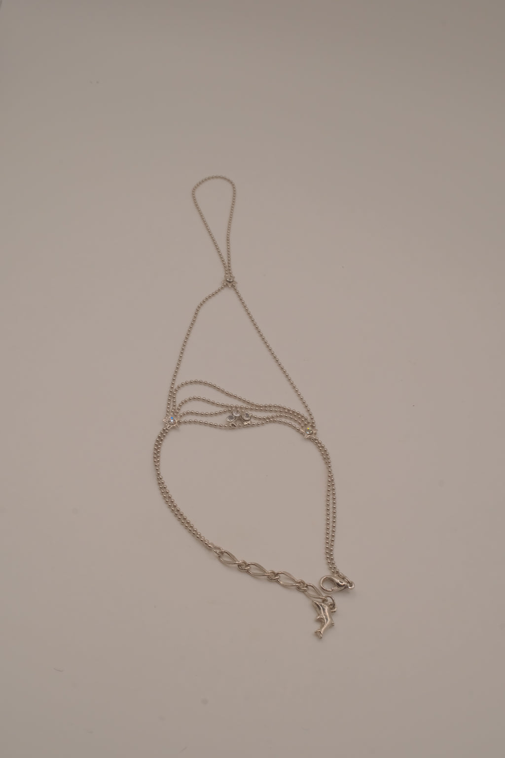 Silver tone white rhinestones hand chain
