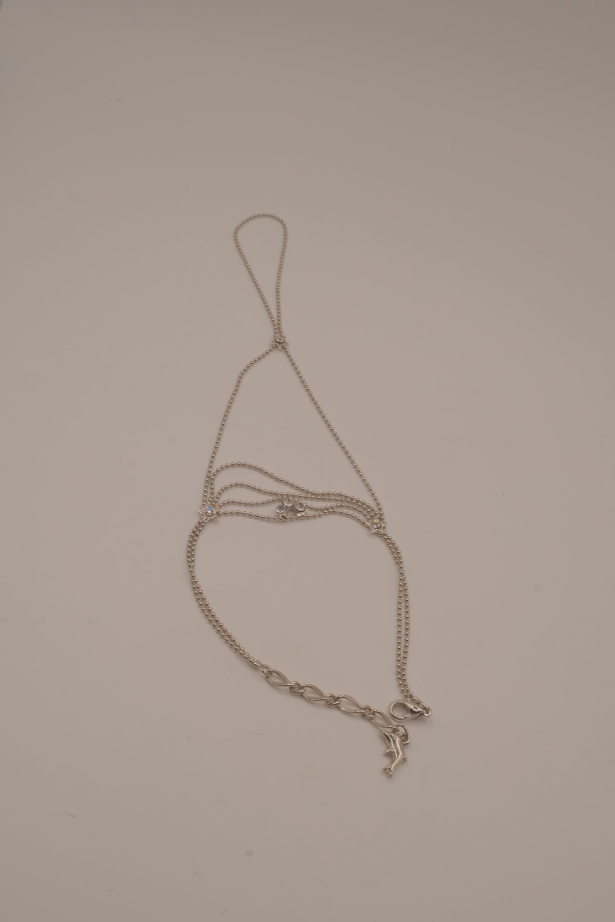 Silver tone white rhinestones hand chain