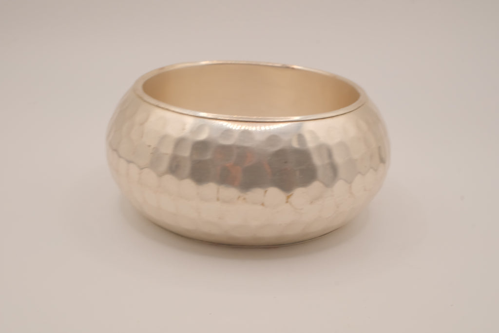Wide, hammered silver-tone bangle bracelet