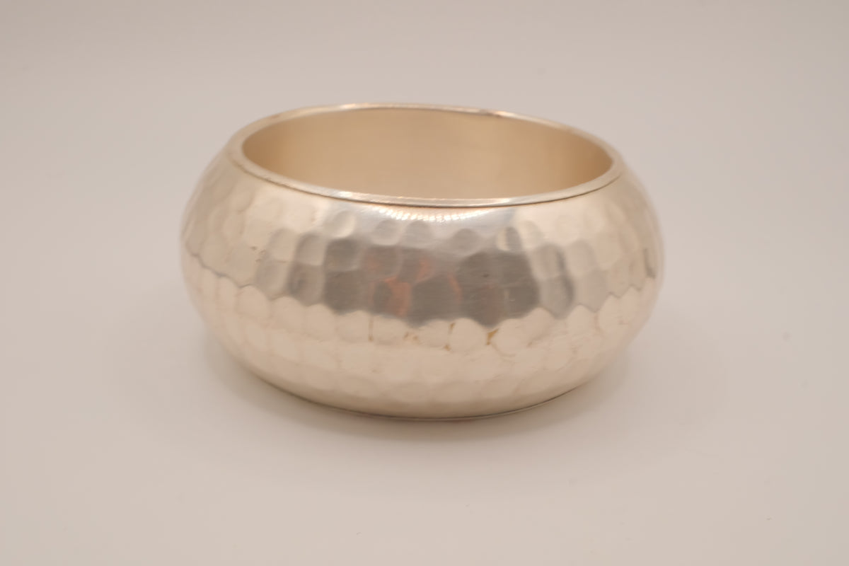 Wide, hammered silver-tone bangle bracelet