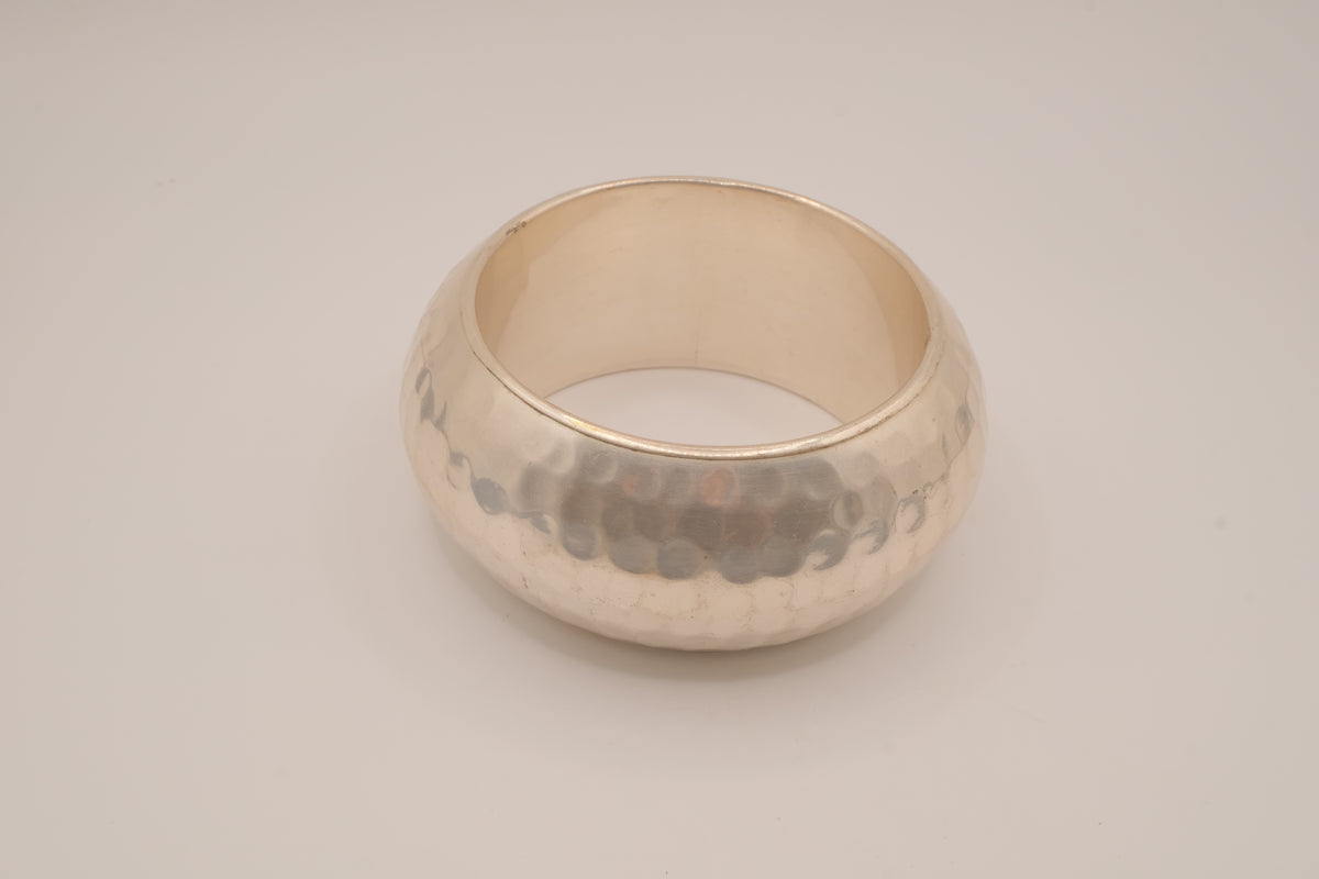 Wide, hammered silver-tone bangle bracelet