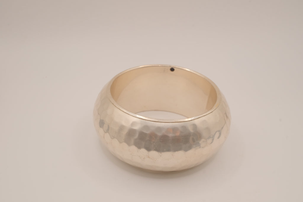 Wide, hammered silver-tone bangle bracelet