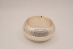 Wide, hammered silver-tone bangle bracelet