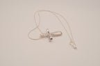 Sterling silver amethyst ribbon-style cross pendant necklace