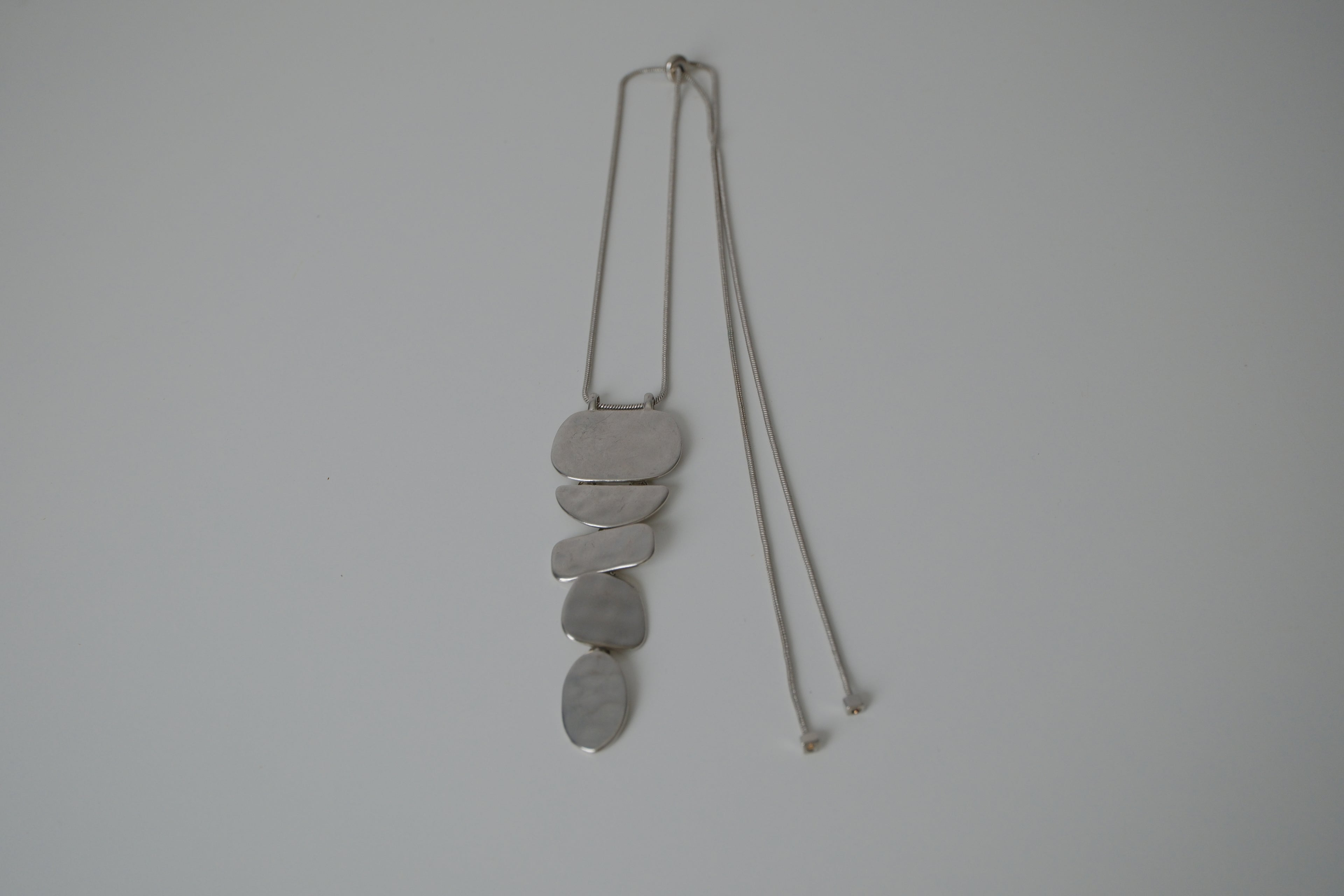Cascading silver tone necklace