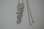 Cascading silver tone necklace