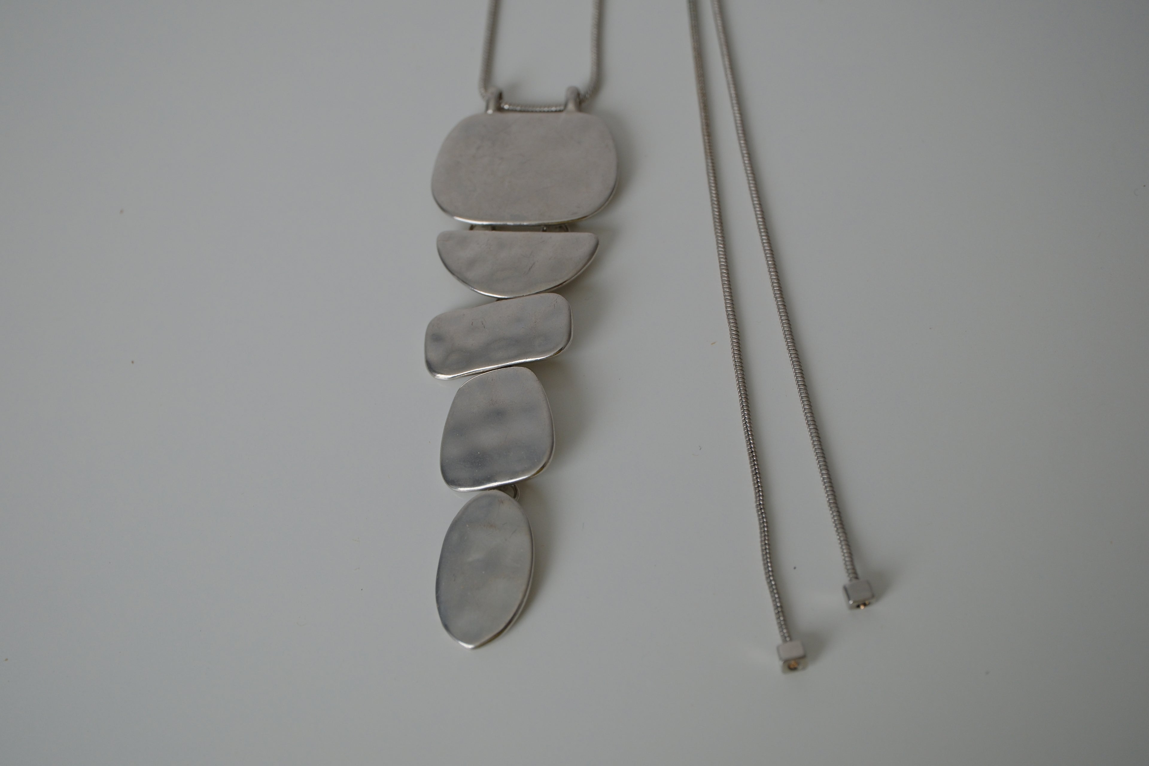 Cascading silver tone necklace