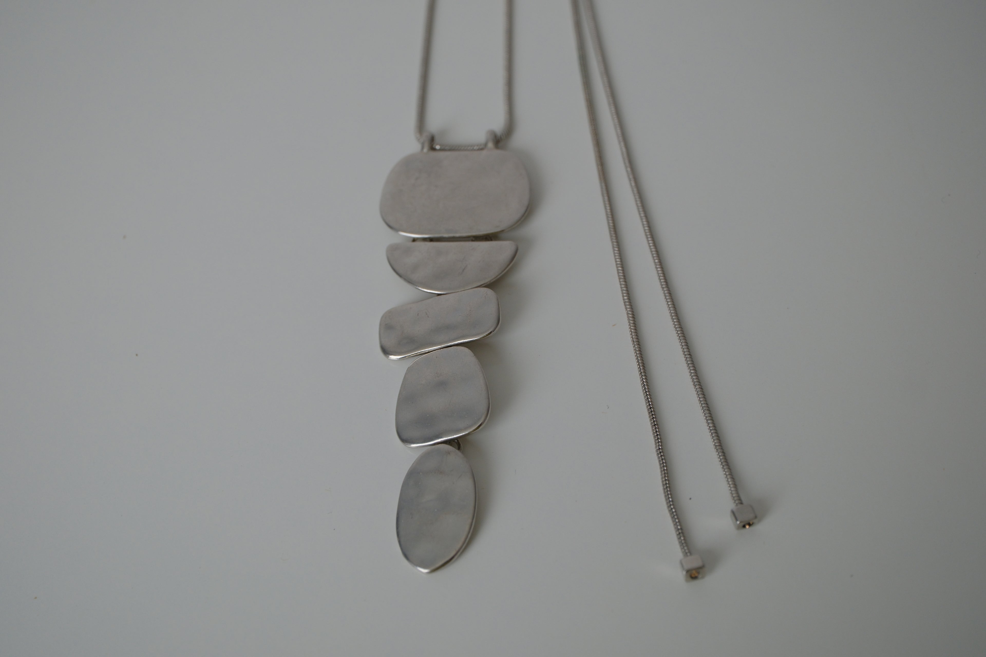 Cascading silver tone necklace
