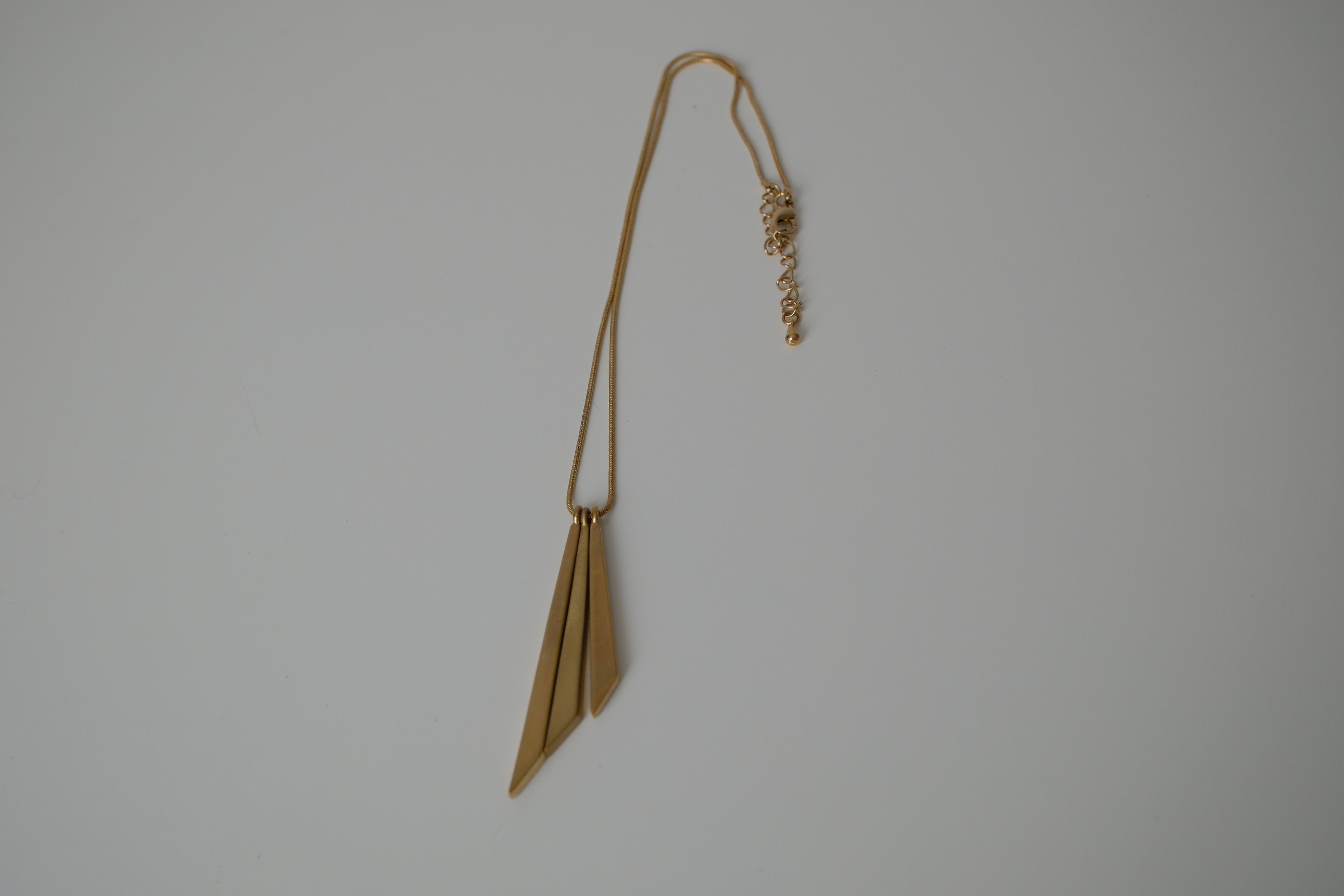 Asymmetric, tiered pendant necklace