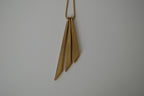 Asymmetric, tiered pendant necklace