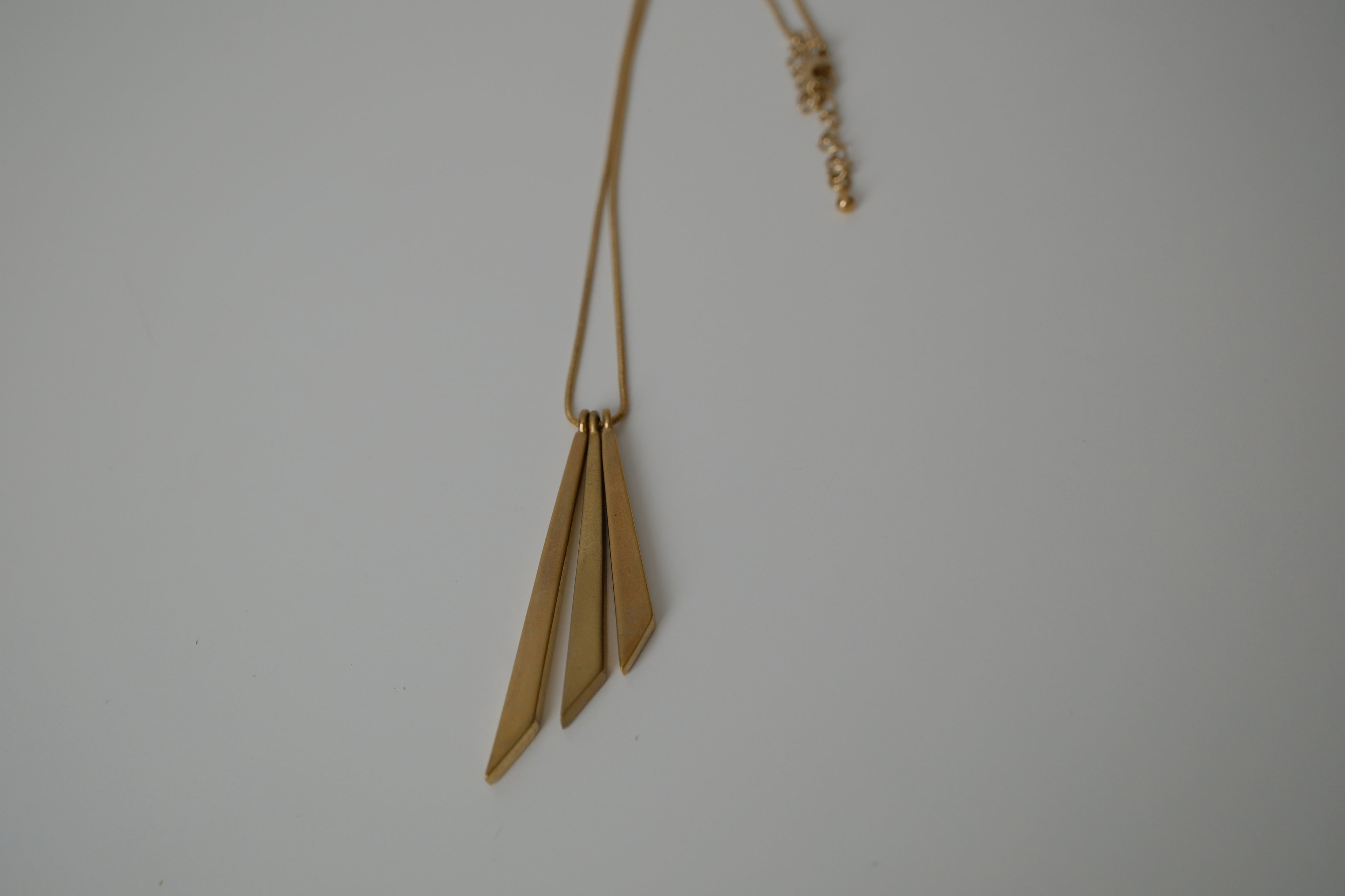 Asymmetric, tiered pendant necklace