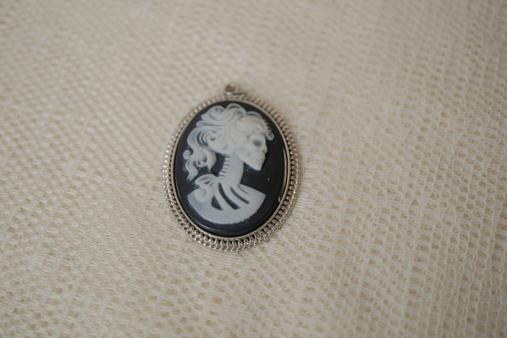 Skeleton cameo pendant