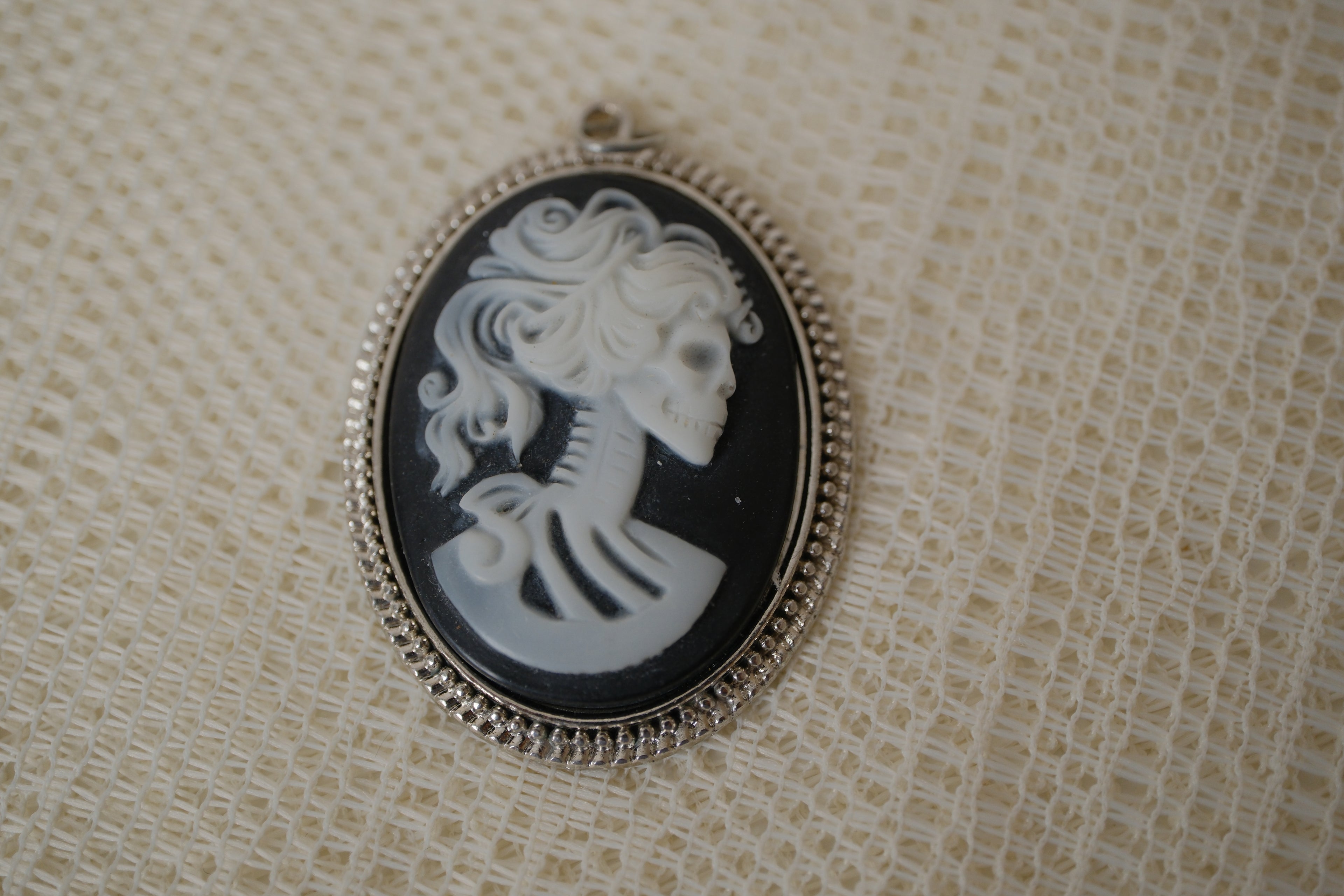 Skeleton cameo pendant