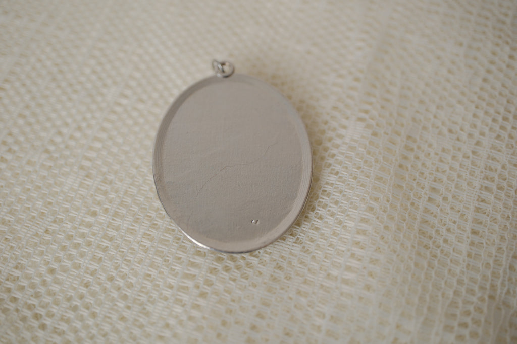 Skeleton cameo pendant