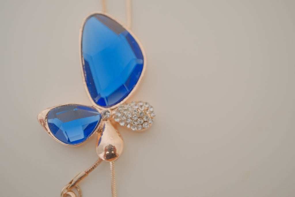 Blue crystal butterfly pendant on Rose Gold chain