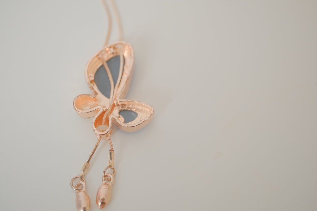 Blue crystal butterfly pendant on Rose Gold chain